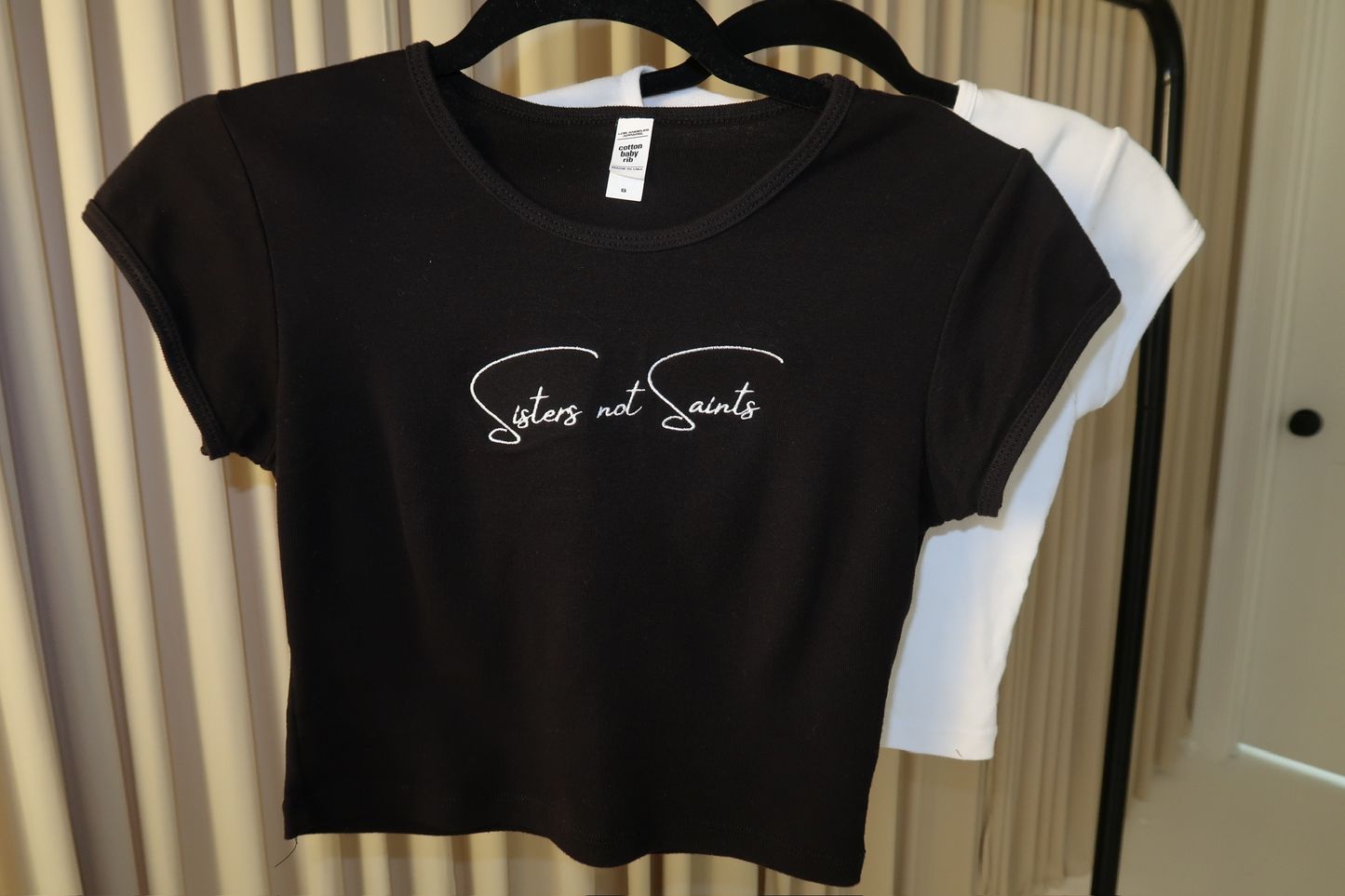 Sisters Not Saints Baby Tee