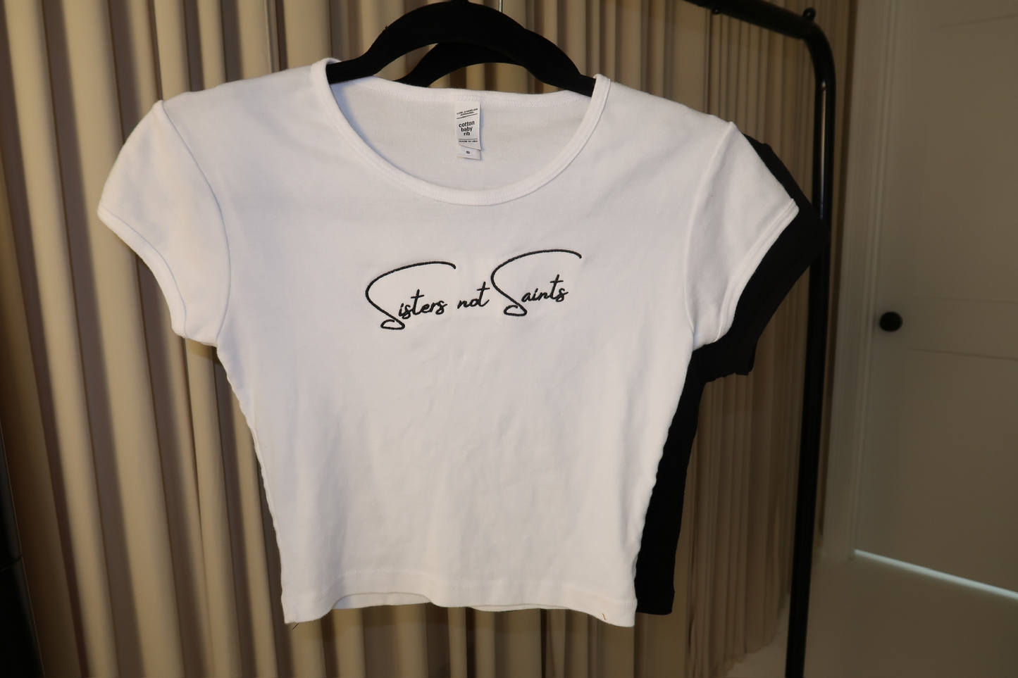 Sisters Not Saints Baby Tee